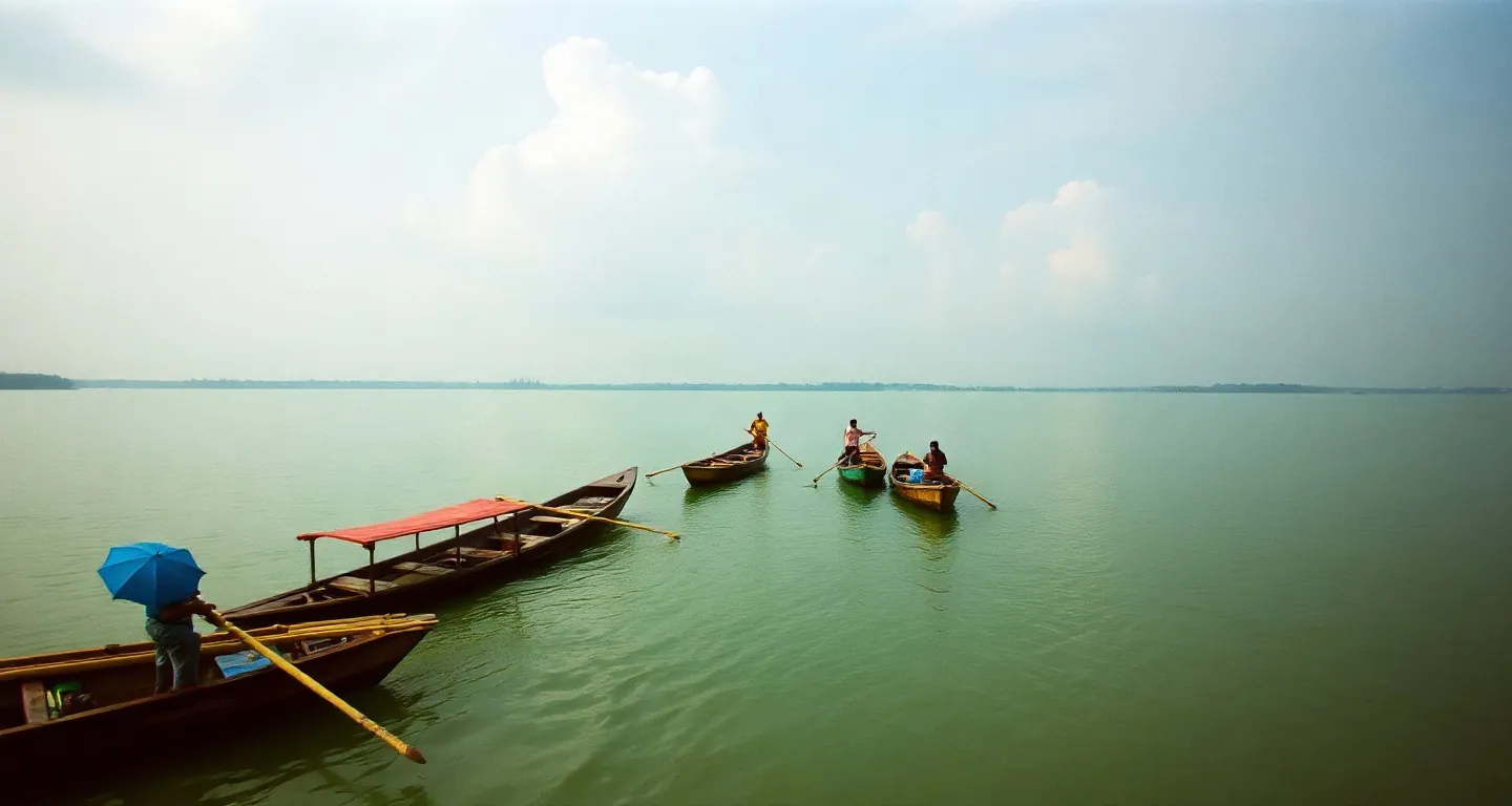 Colourful wooden boats on a wide green river under monsoon clouds, Bangladesh